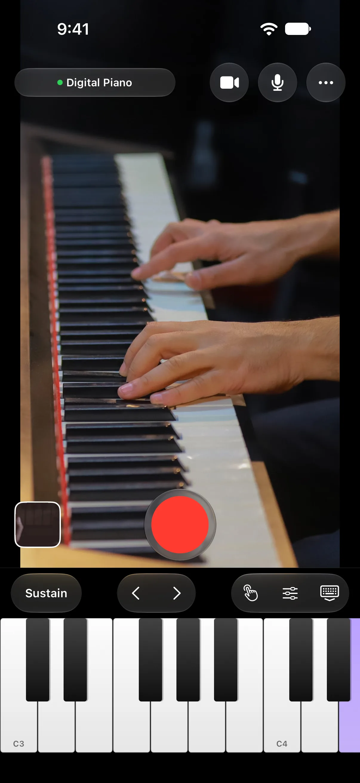 The Goldtake camera screen: hands playing a digital piano and the connected piano's name